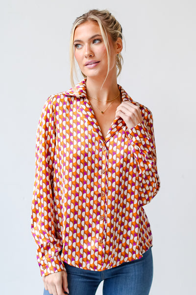 model wearing a trendy Satin Button-Up Blouse