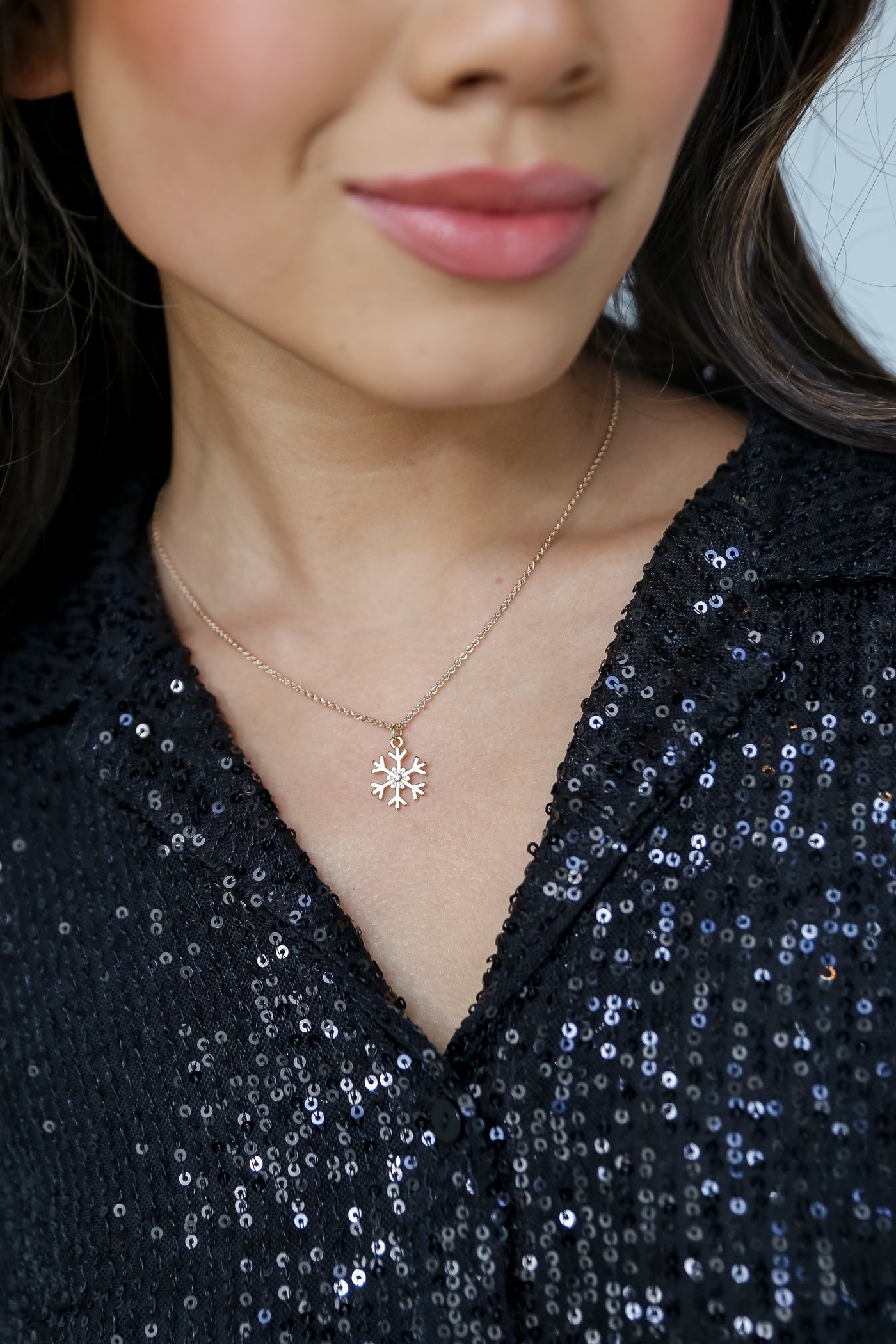 Gold Snowflake Charm Necklace on model