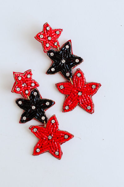 Red + Black Beaded Star Drop Earrings flat lay