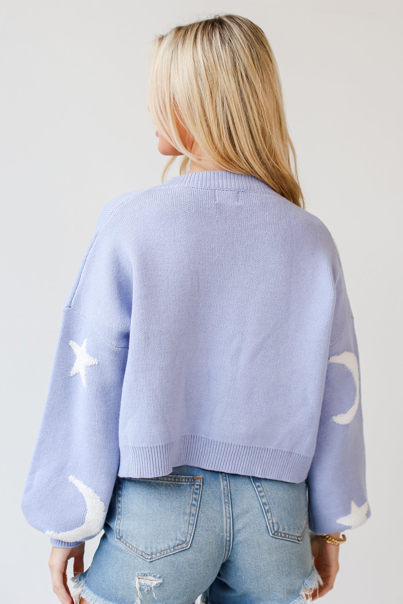 blue star and moon Sweater back view