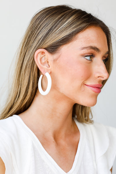 white Matte Hoop Earrings on model
