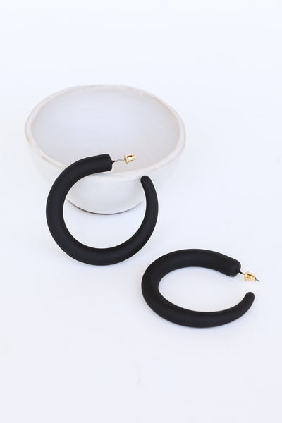 black Matte Hoop Earrings flat lay