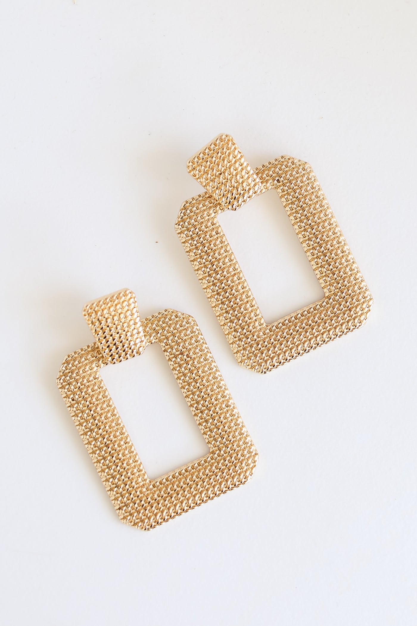 Gold Statement Earrings flat lay