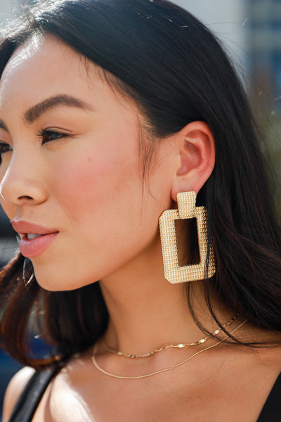Gold Statement Earrings on model