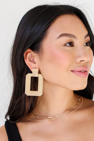 model wearing Gold Statement Earrings