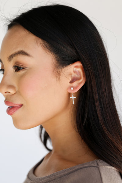 Gold Rhinestone Cross Earrings on model