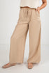 Beige wide-leg pants worn by a person on a white background