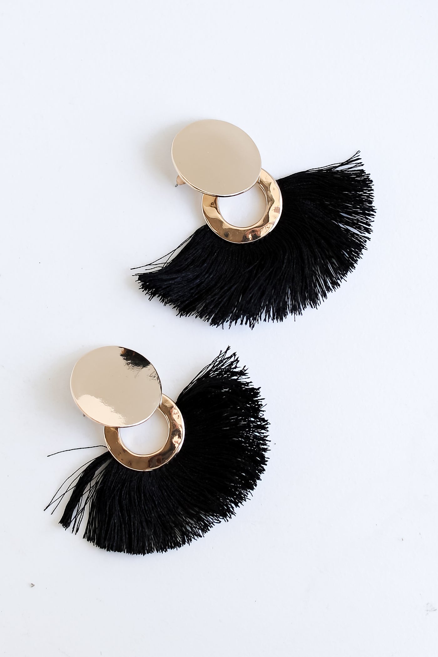 black Tassel Fan Earrings flat lay