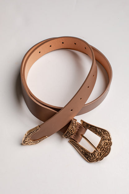 A tan leather belt with an ornate, engraved bronze-toned buckle, coiled on a light gray background.