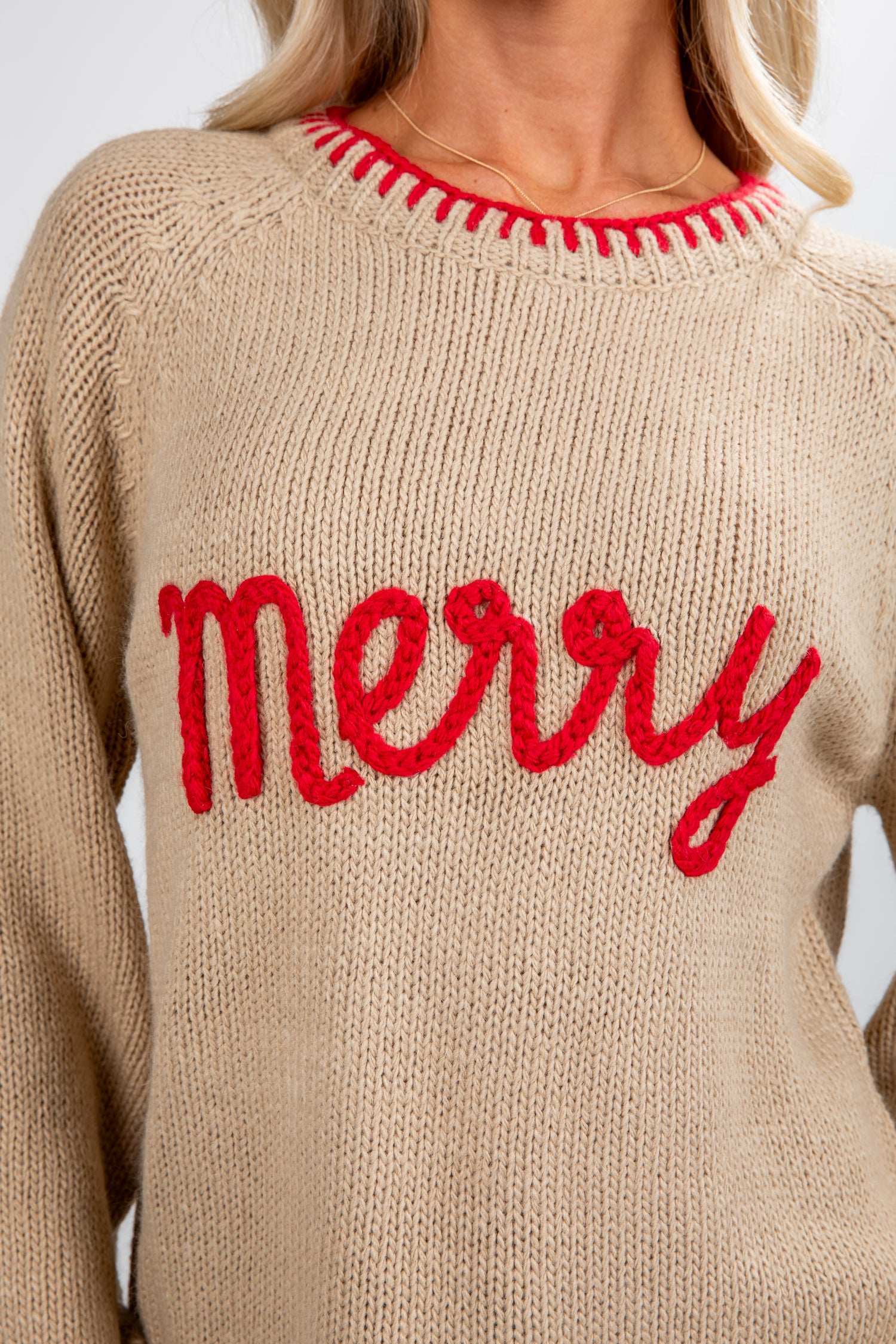 Beige sweater with red &