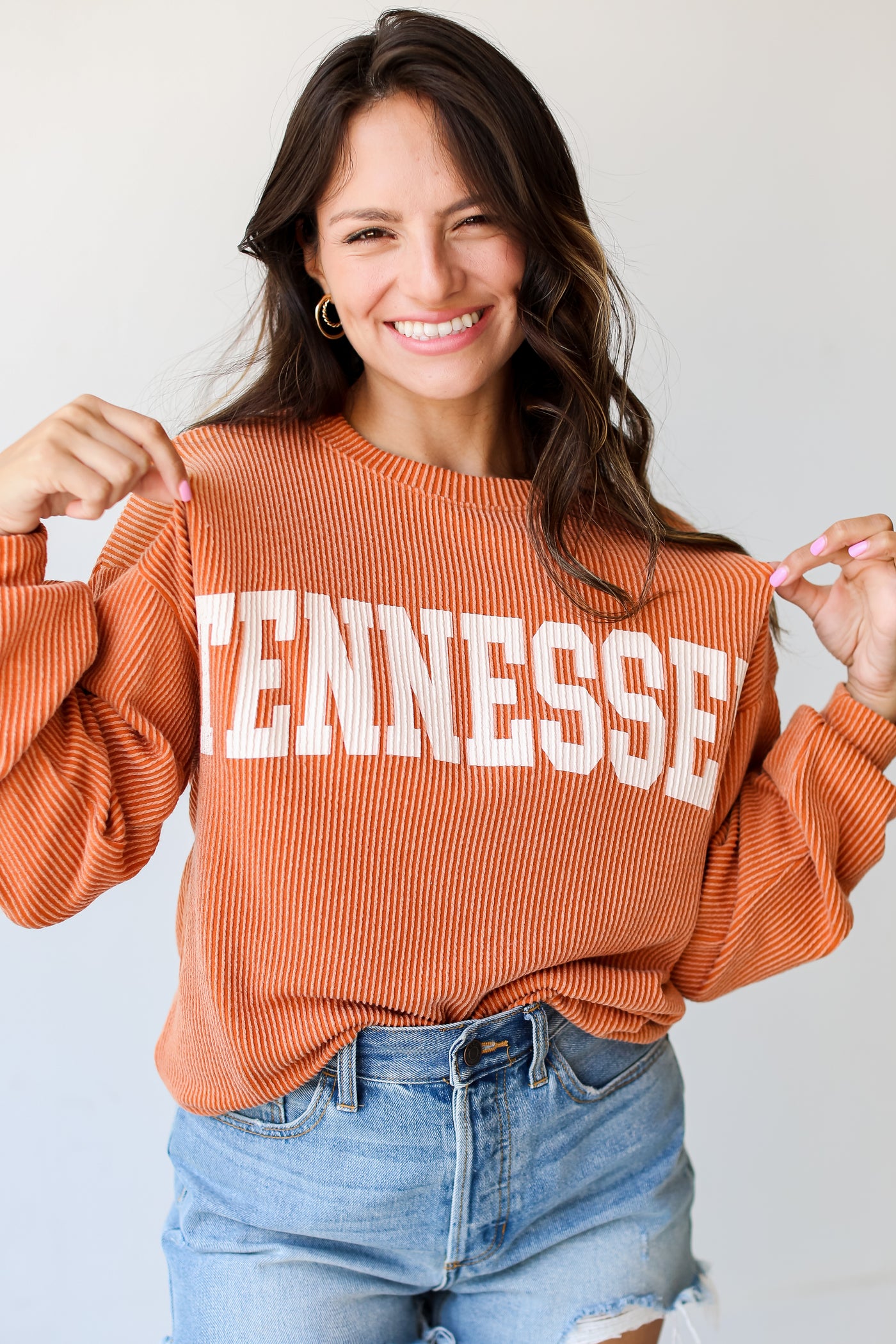 orange Tennessee Corded Pullover on dress up model