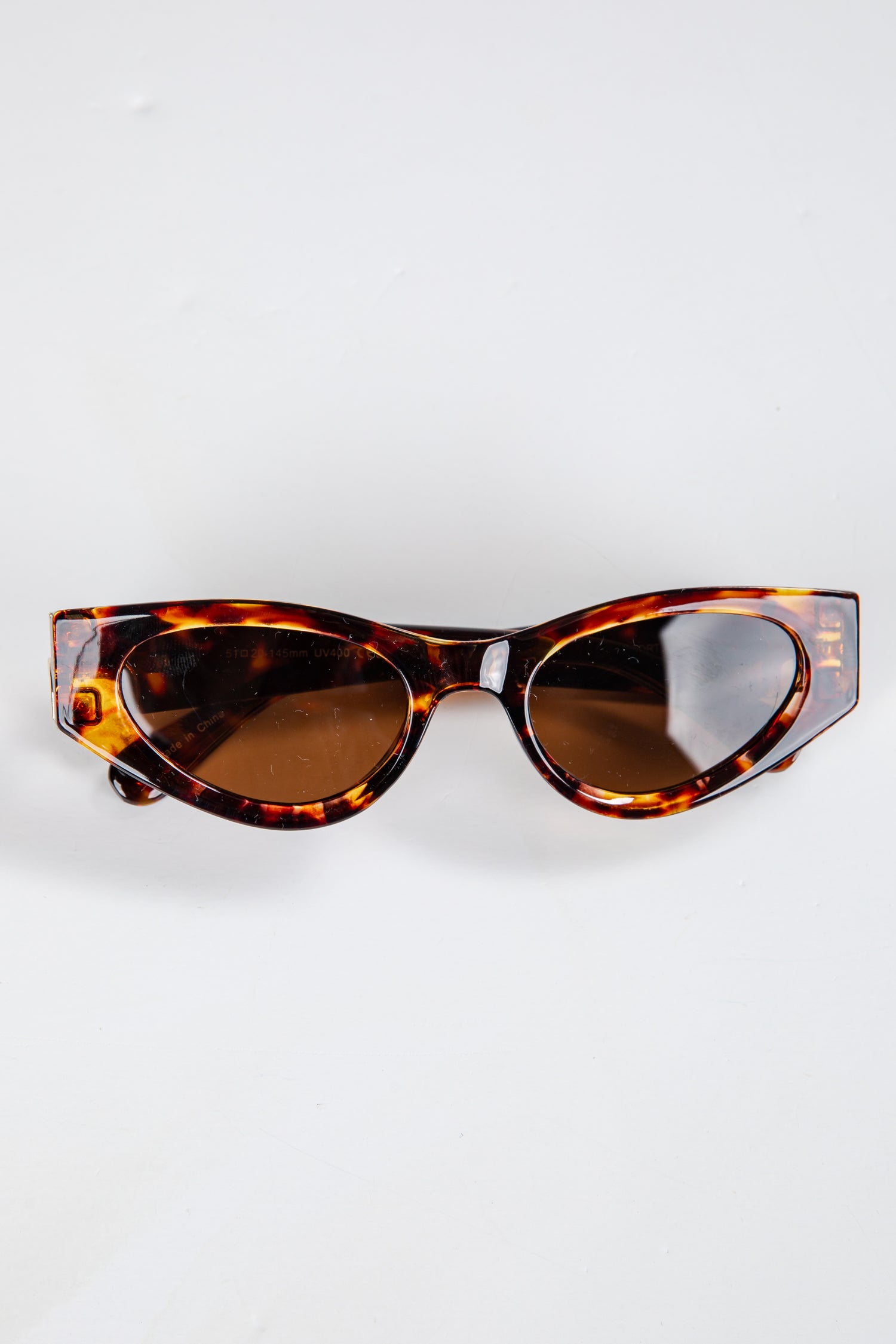 Tortoiseshell sunglasses on a white background