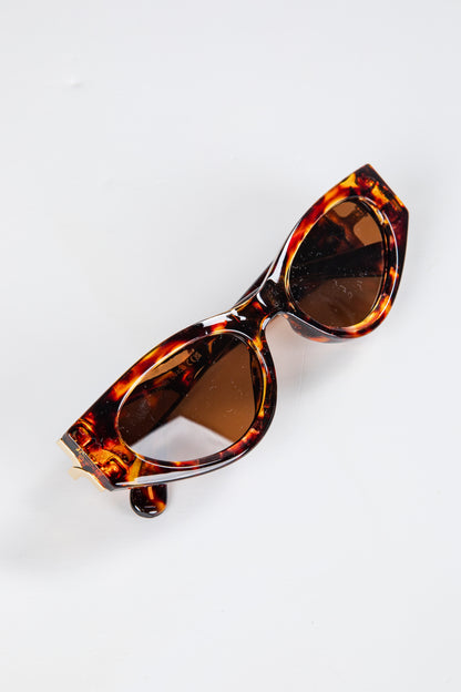 Tortoiseshell sunglasses on a white background