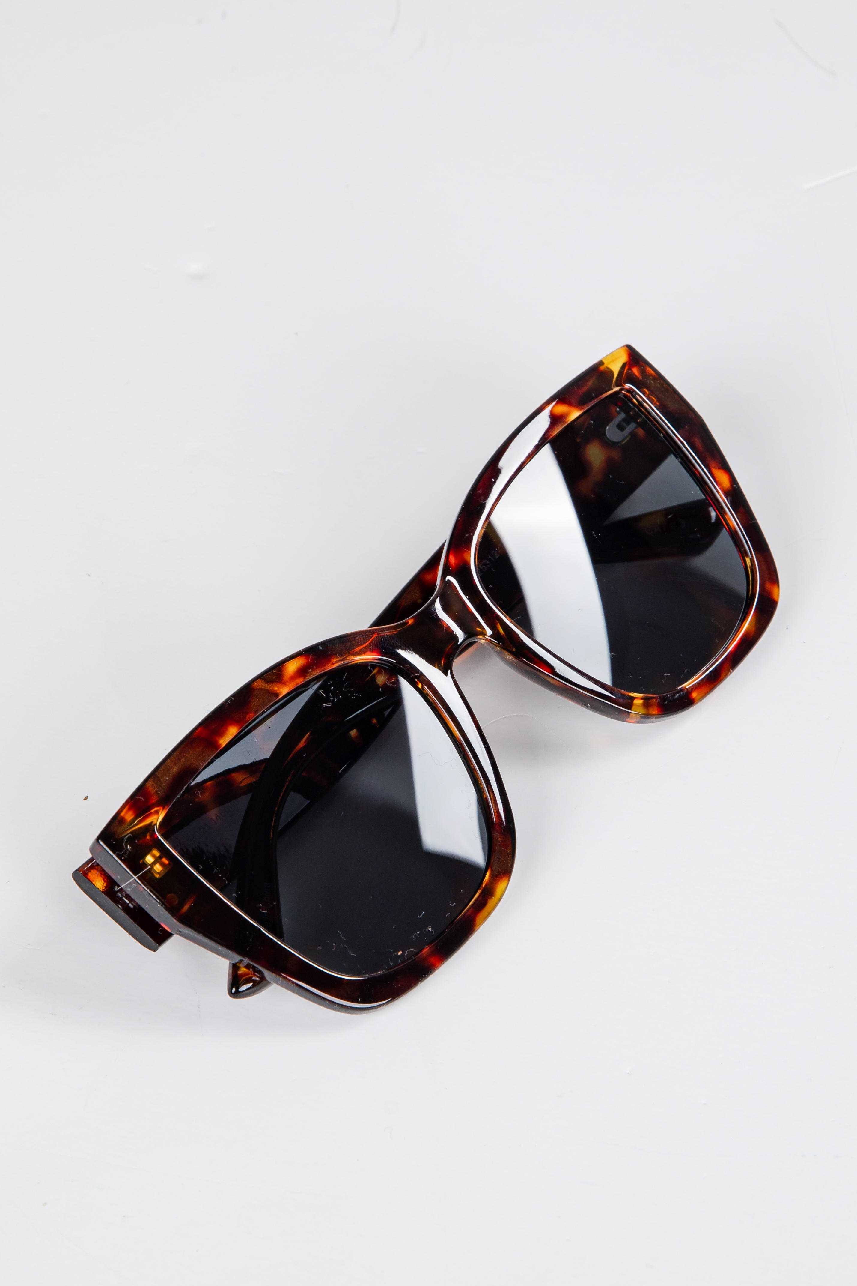 Tortoiseshell sunglasses on a white background