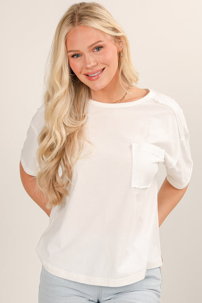 Woman wearing a white blouse with a neutral background