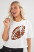 Woman wearing a white t-shirt with a brown football graphic on a plain background