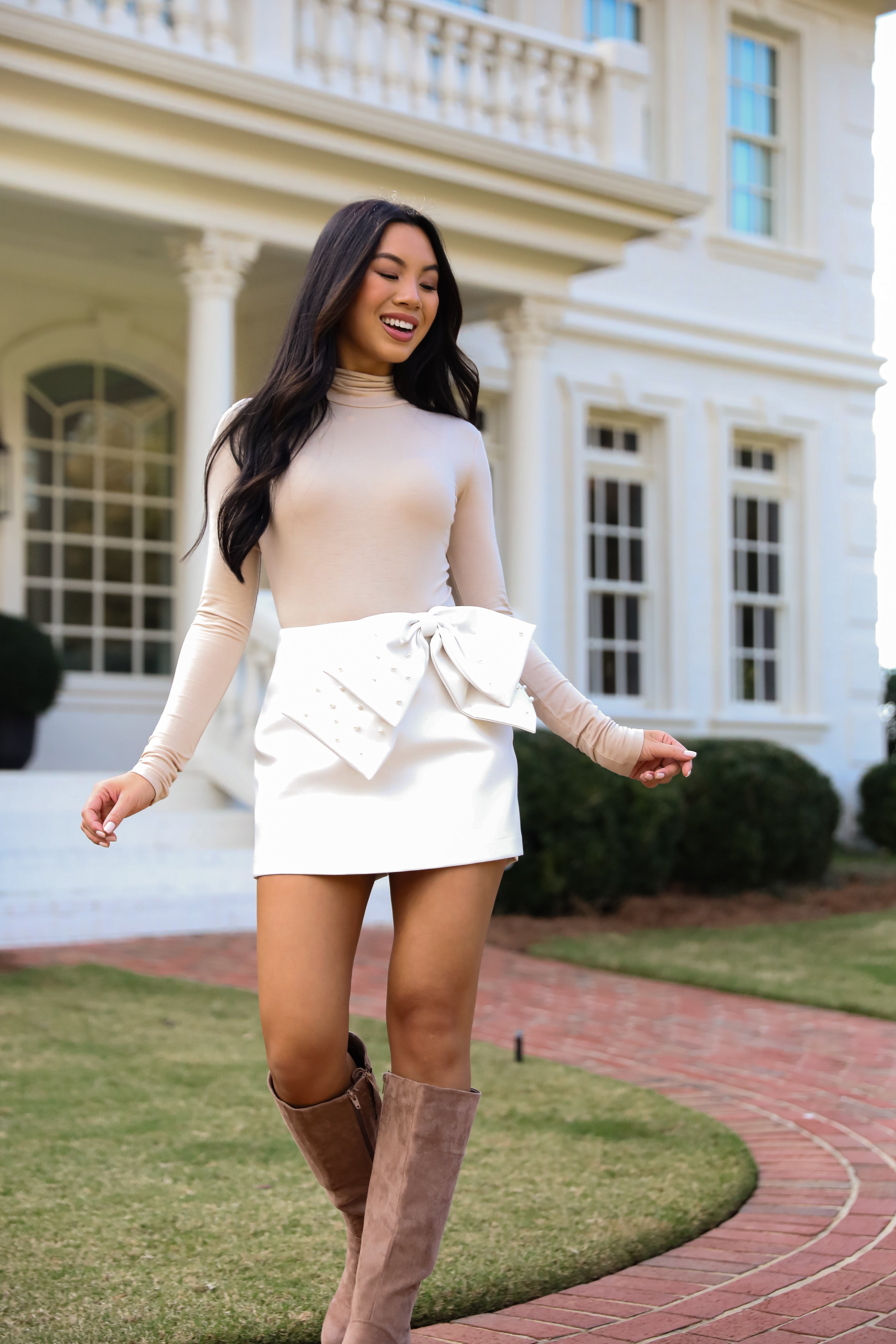 Notorious Perfection Off White Pearl Bow Leather Mini Skort