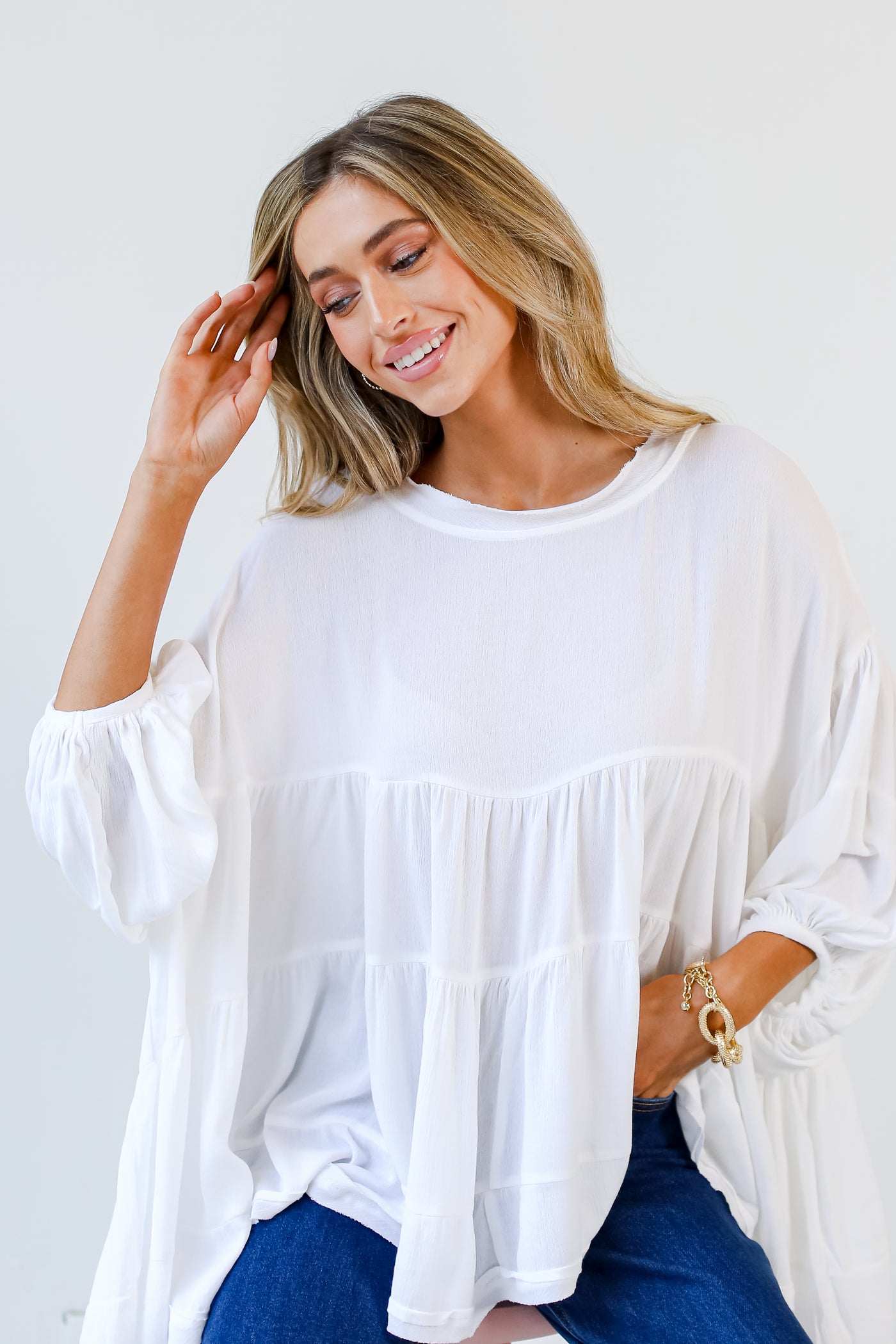 model wearing a white Tiered Oversized Blouse