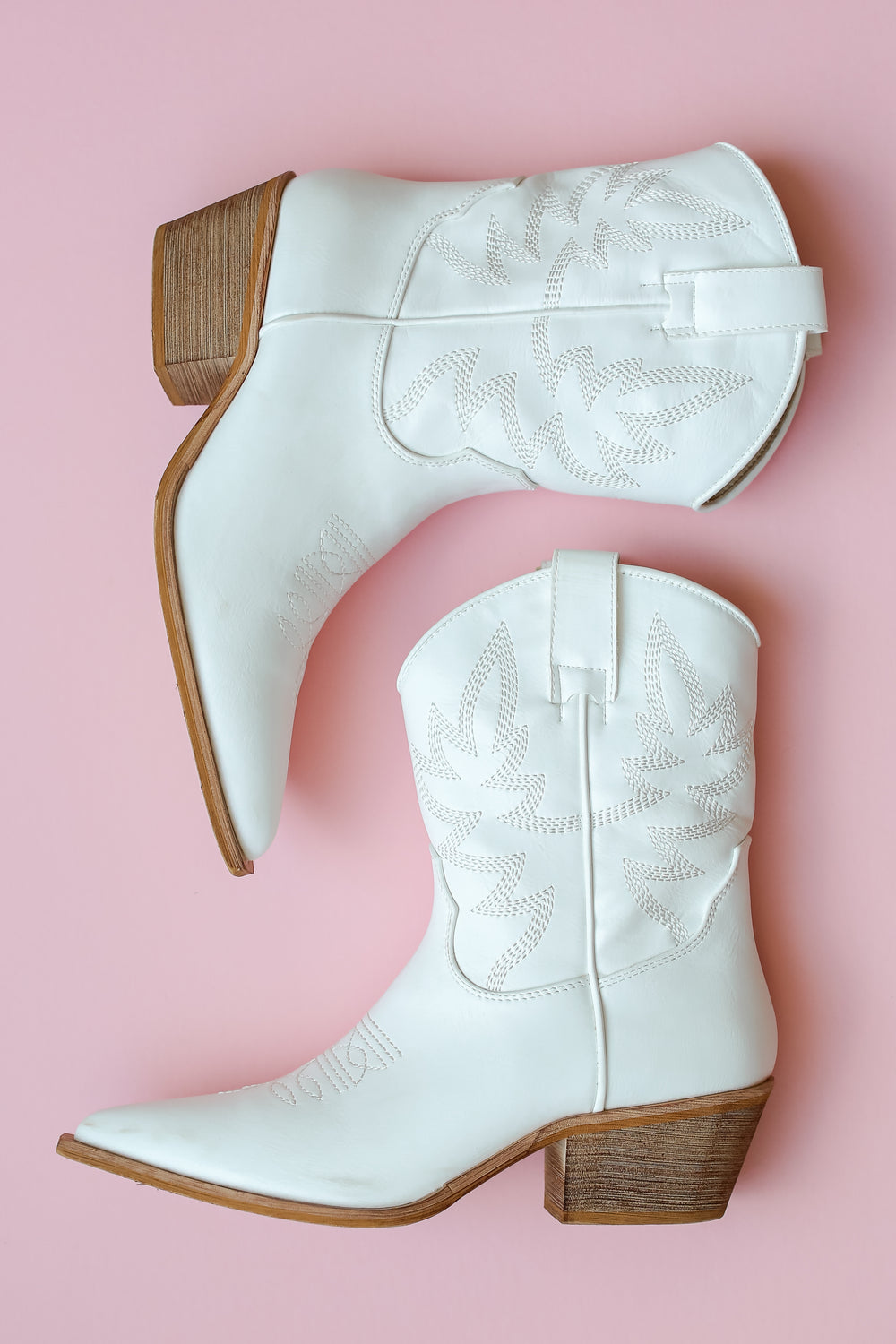 white Western Booties flat lay