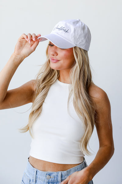 white Woodstock Embroidered Hat on model