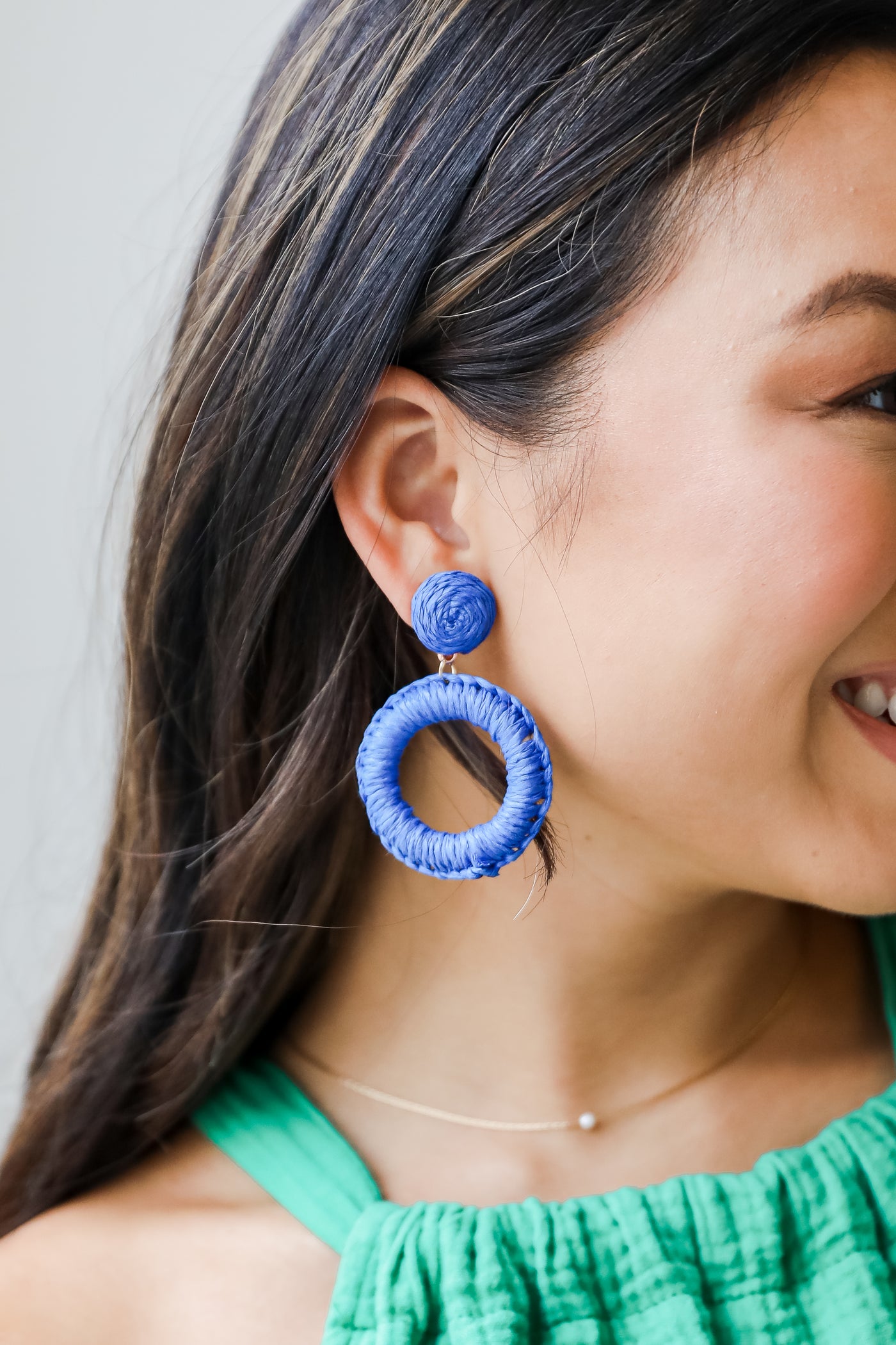 blue Straw Statement Earrings on model