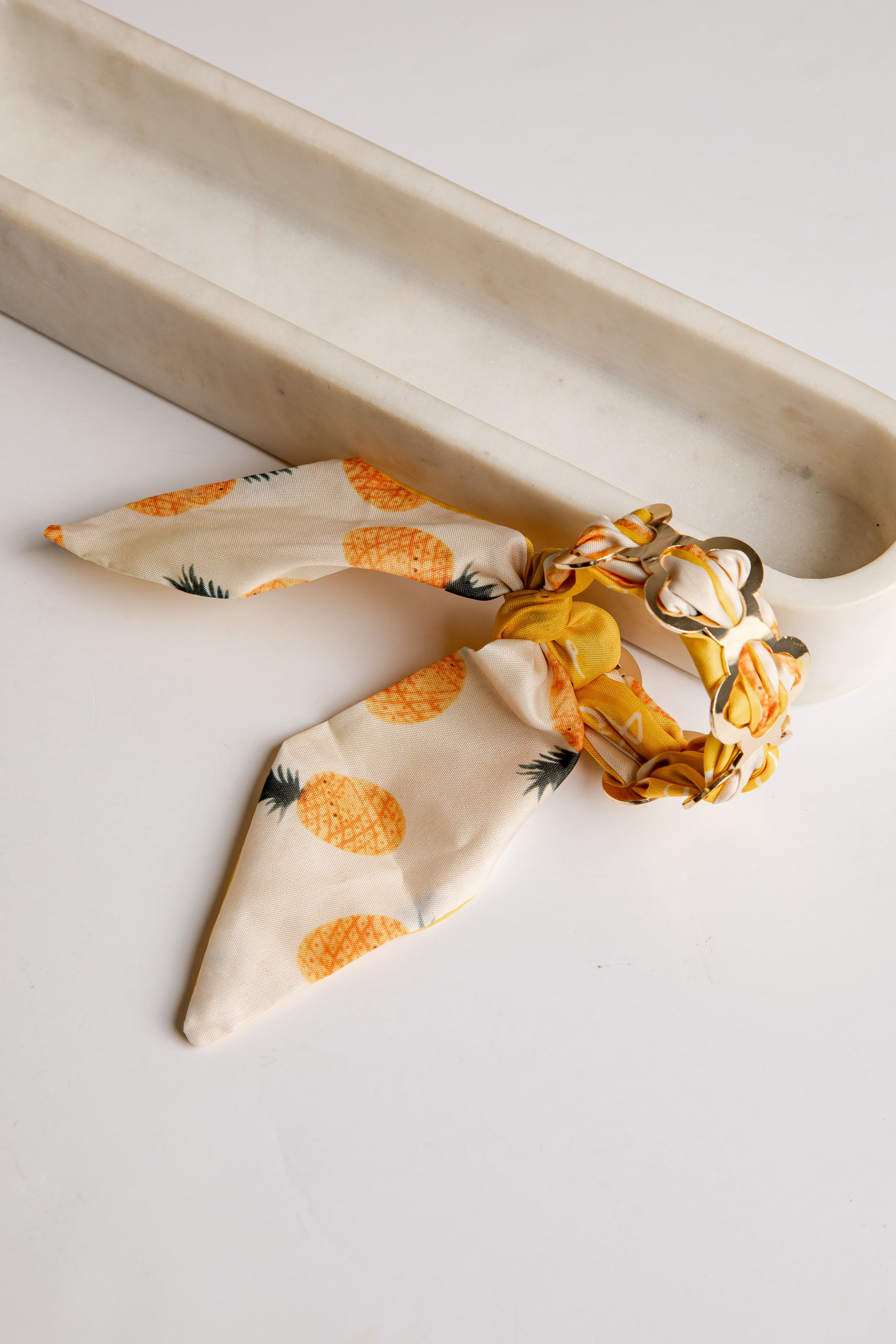 Necklace with pineapple pattern on a white surface