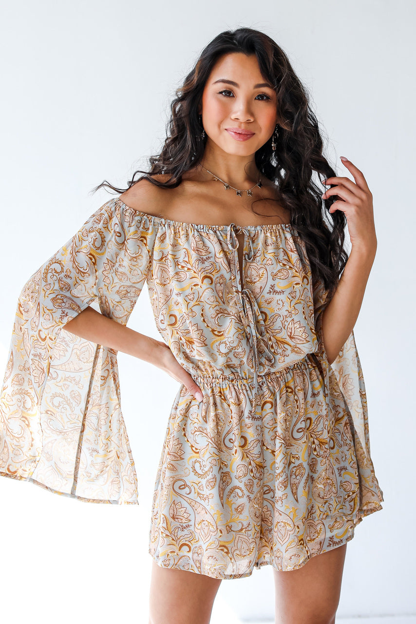 front view of model wearing paisley romper