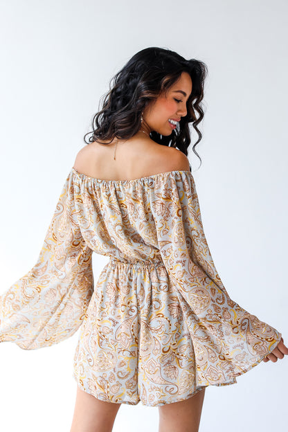 back view of model wearing paisley romper