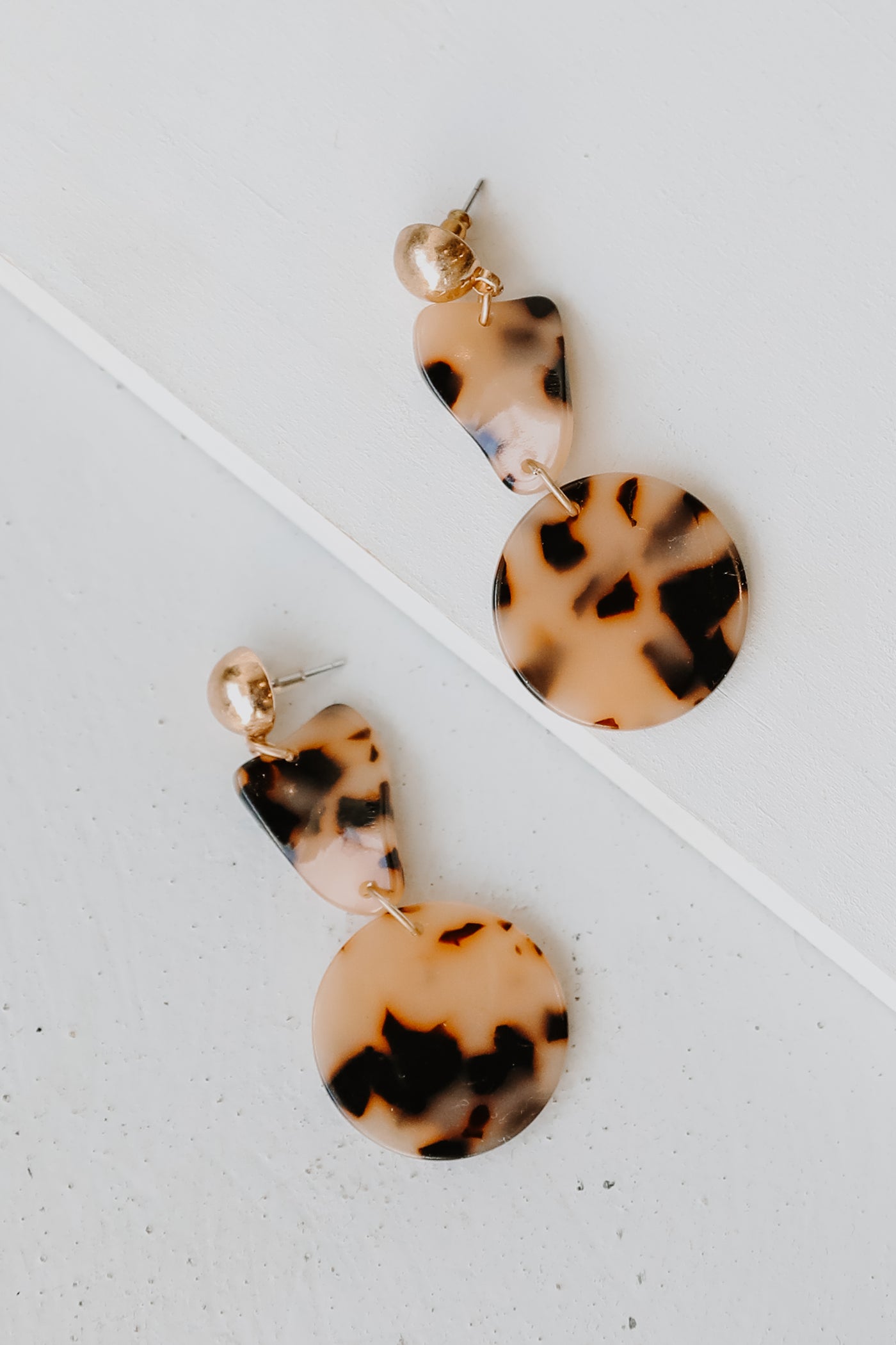 Acrylic Drop Earrings in tortoise flat lay