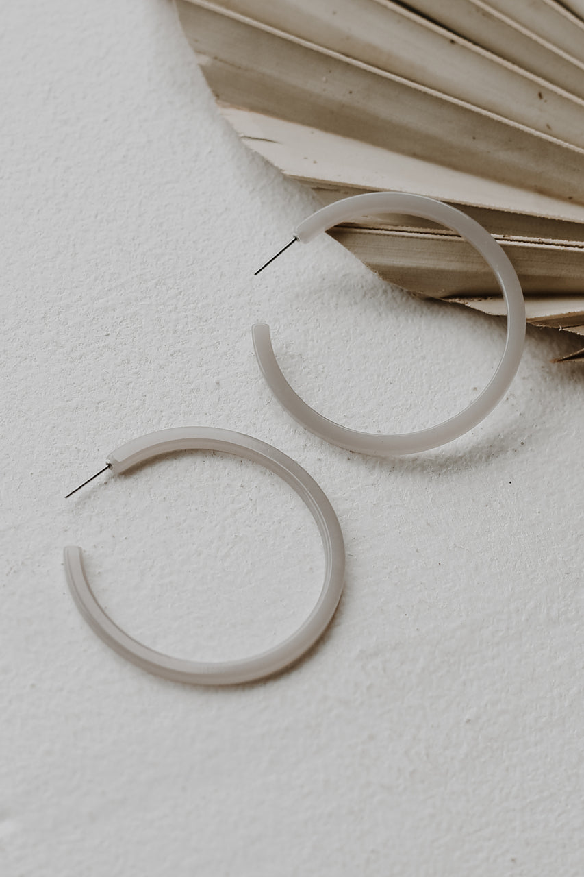 Acrylic Hoop Earrings in grey flat lay