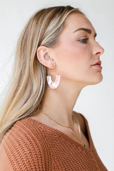side view of pink earrings