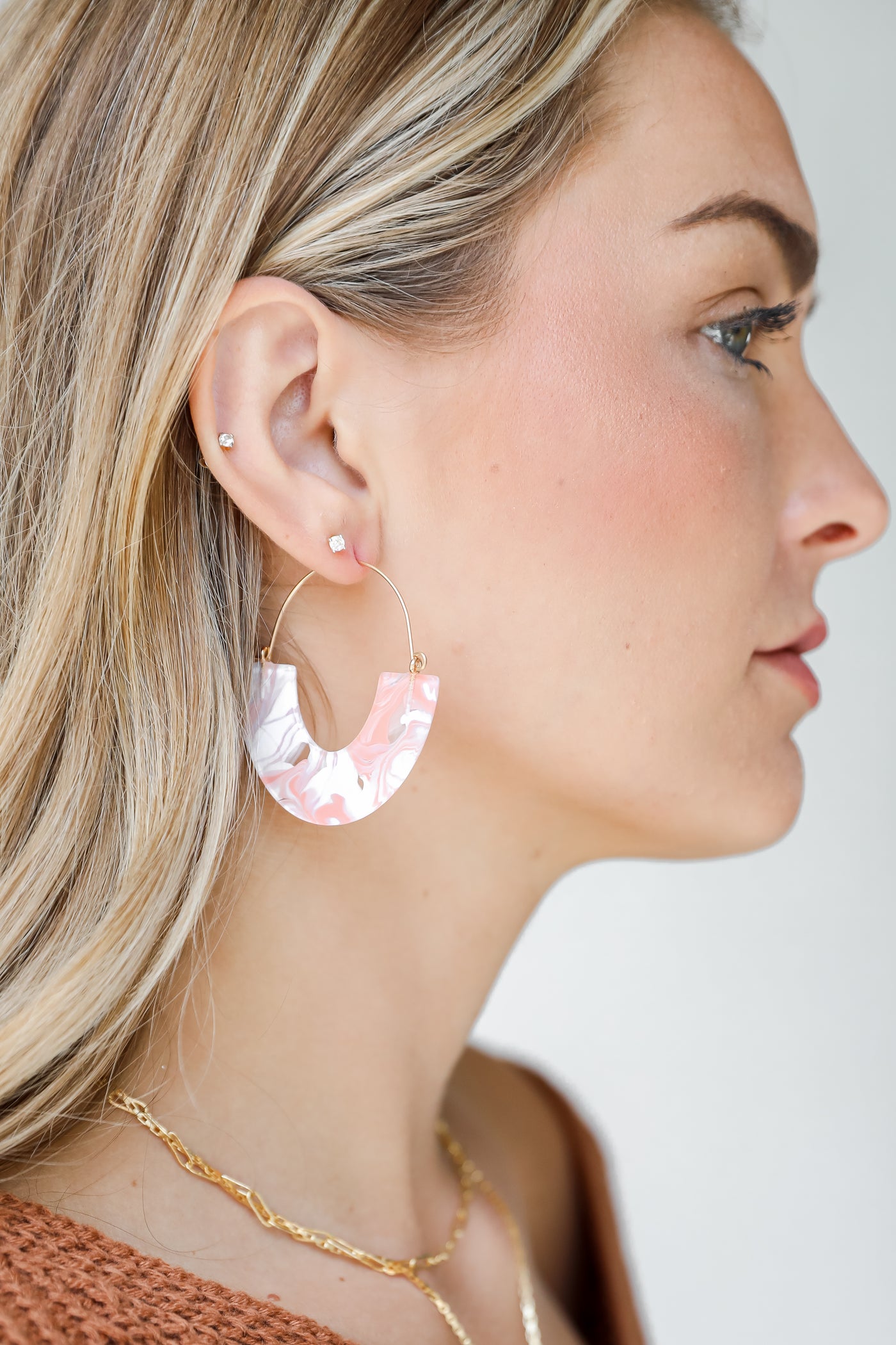 model wearing acrylic earrings