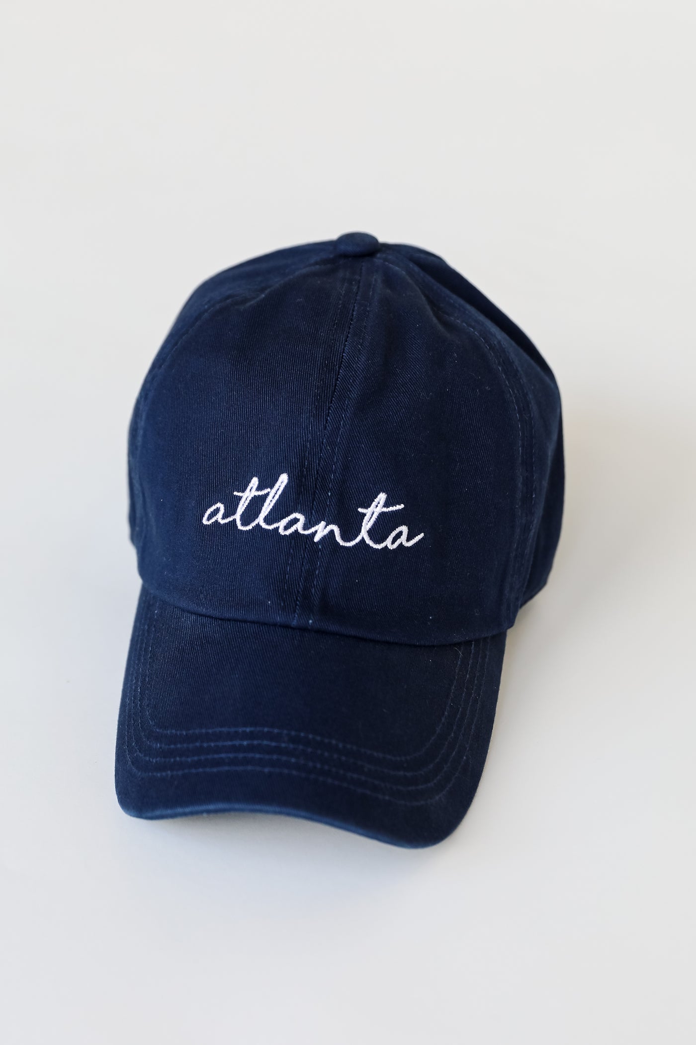 Atlanta Script Embroidered Hat in navy flat lay