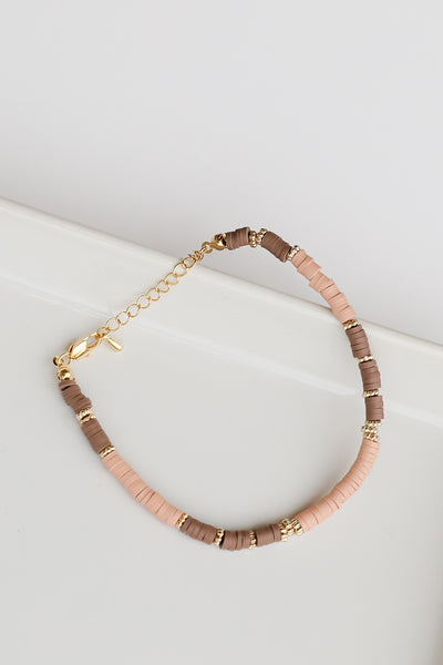 Beaded Bracelet in brown flat lay