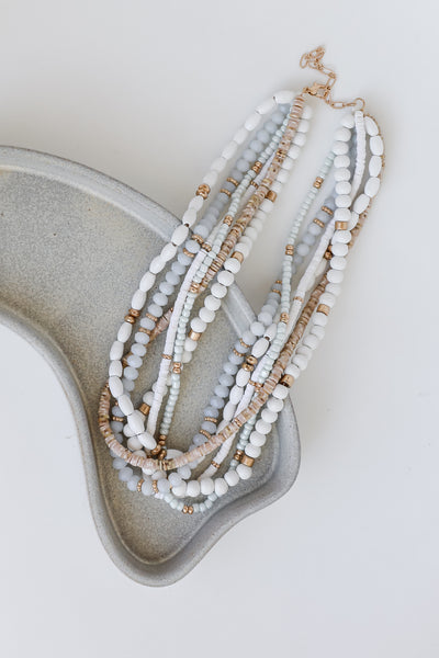 white Beaded Layered Necklace flat lay