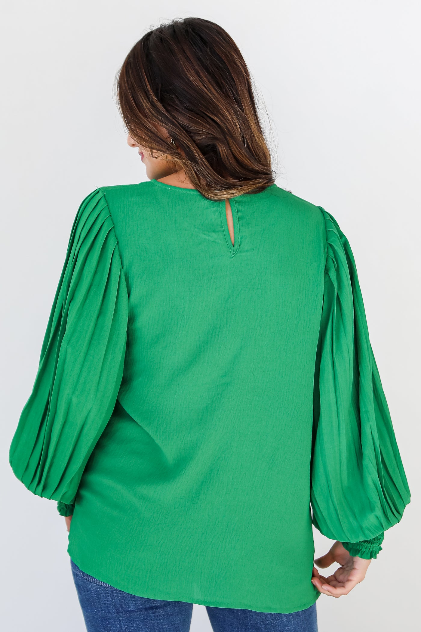 green pleated sleeve blouse back view