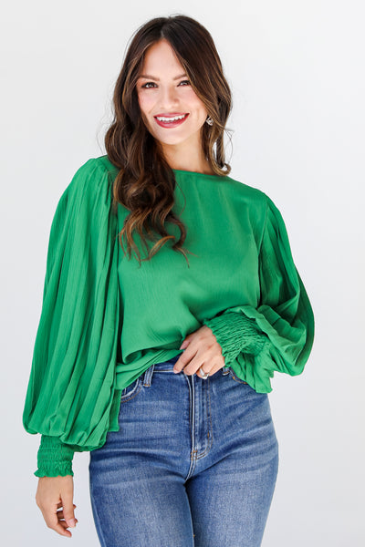 green pleated sleeve blouse on model