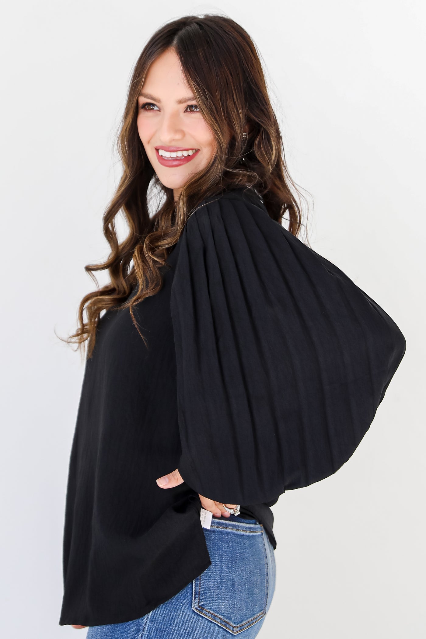 black pleated sleeve blouse side view