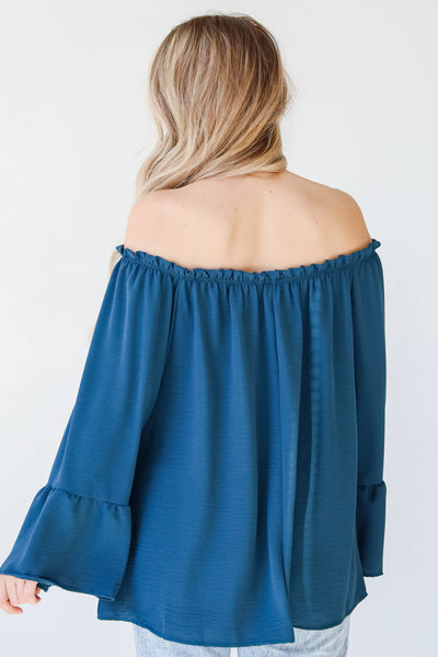 blue off the shoulder blouse back view