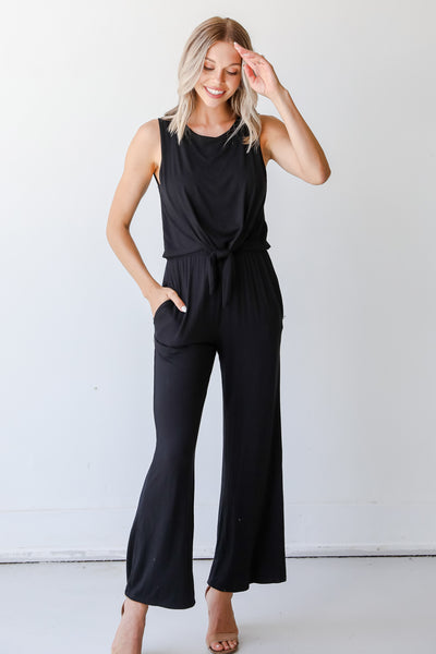 model wearing a black Jumpsuit