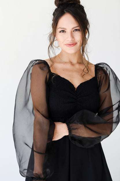 black mesh sleeve mini dress front view