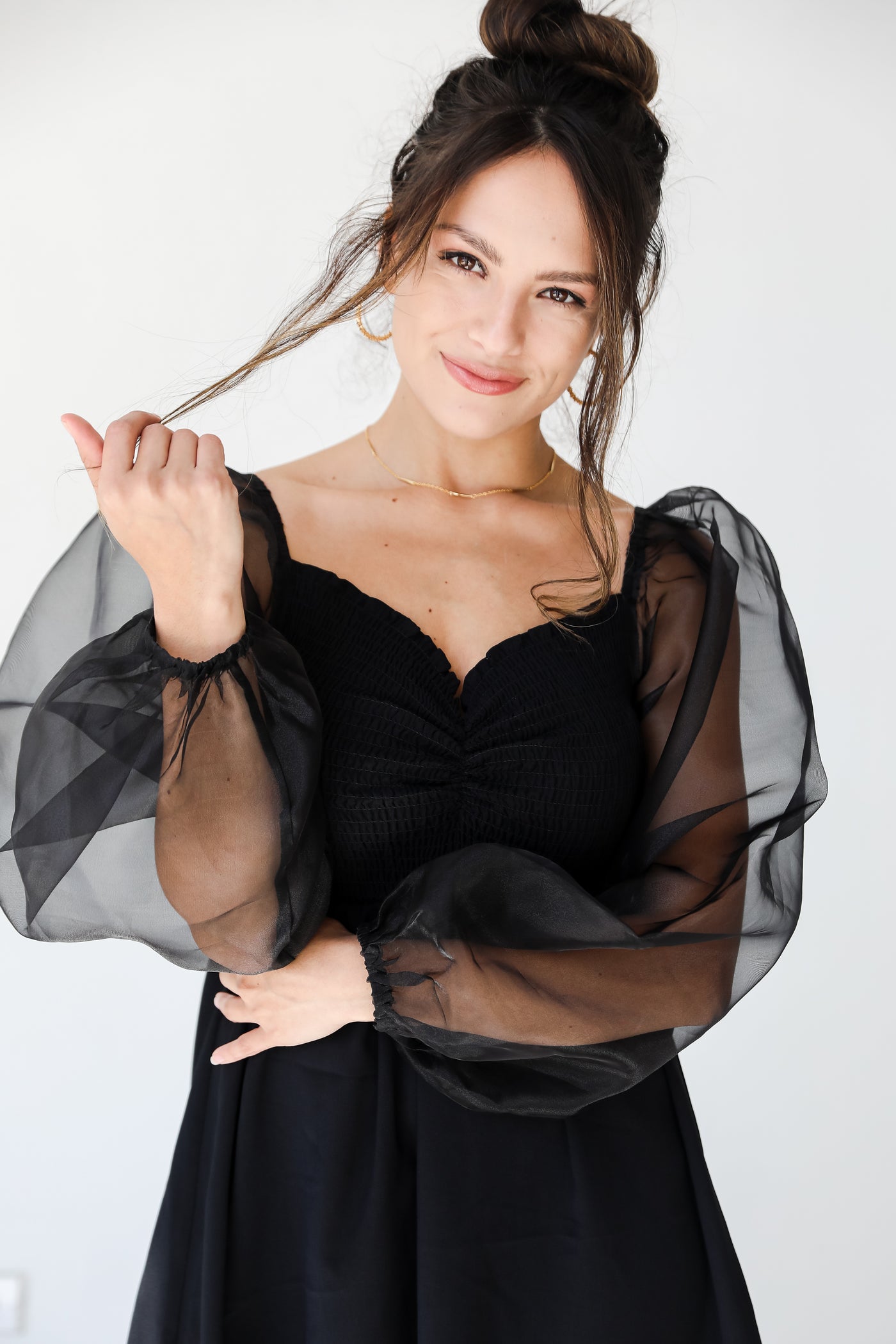 black mesh sleeve mini dress on model