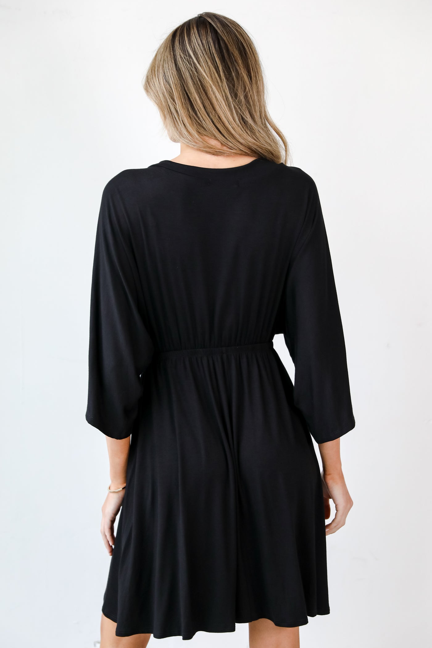 black Surplice Mini Dress back view
