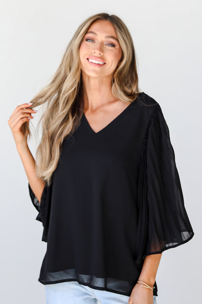 black Pleated Sleeve Blouse front view on model