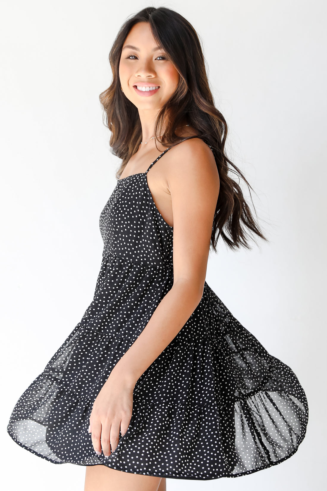 black Polka Dot Mini Dress on model