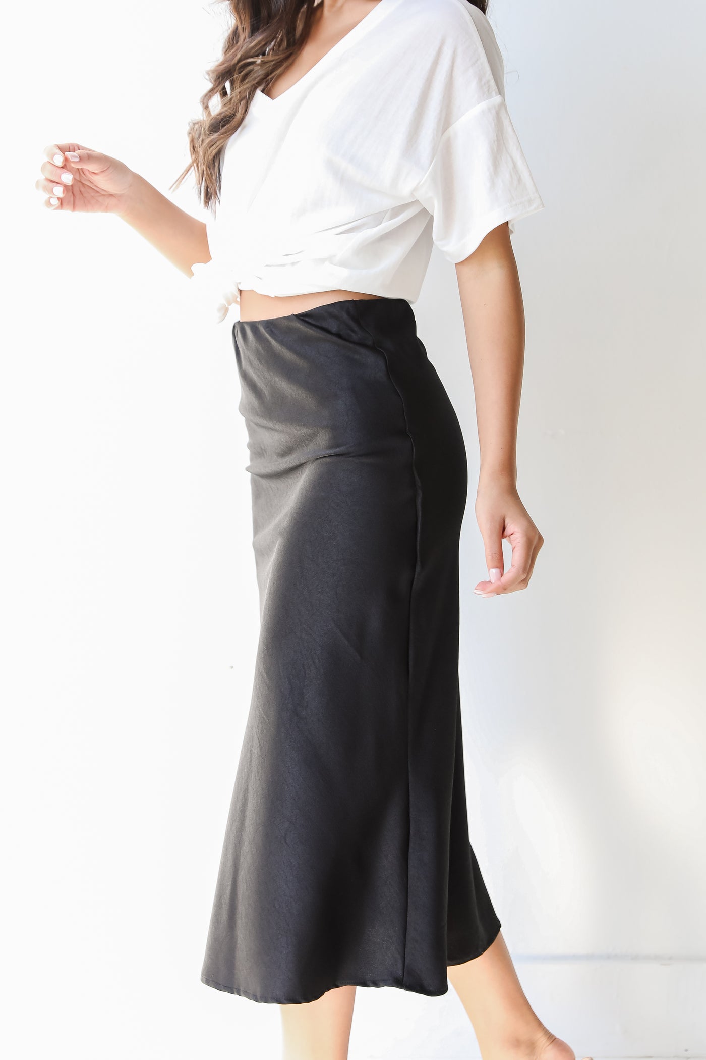 shiny black midi skirt side view
