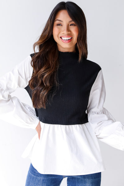 model wearing a sweater vest blouse