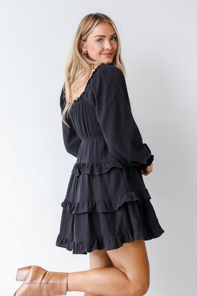 black tiered dress on model