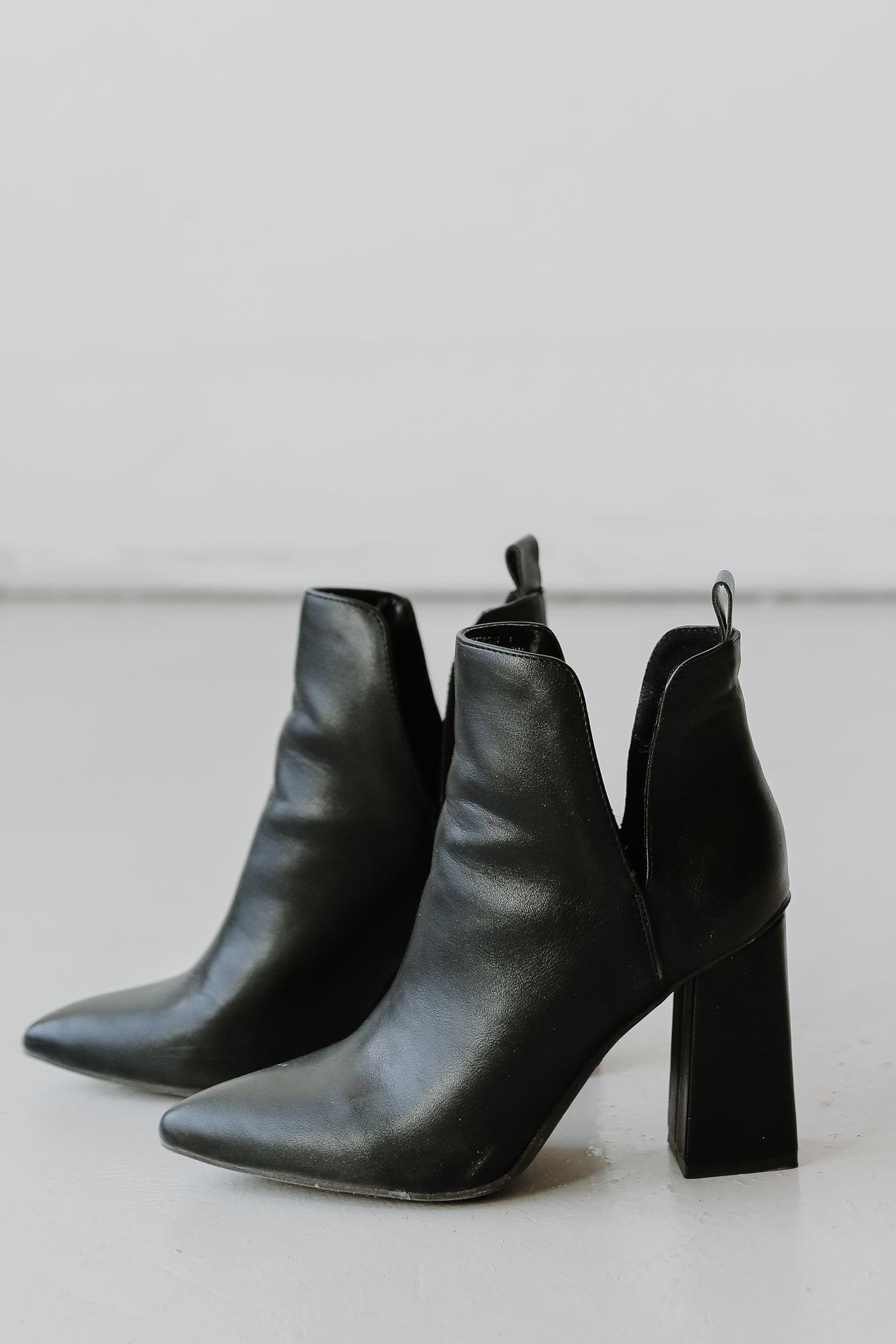 Ankle Booties in black flat lay