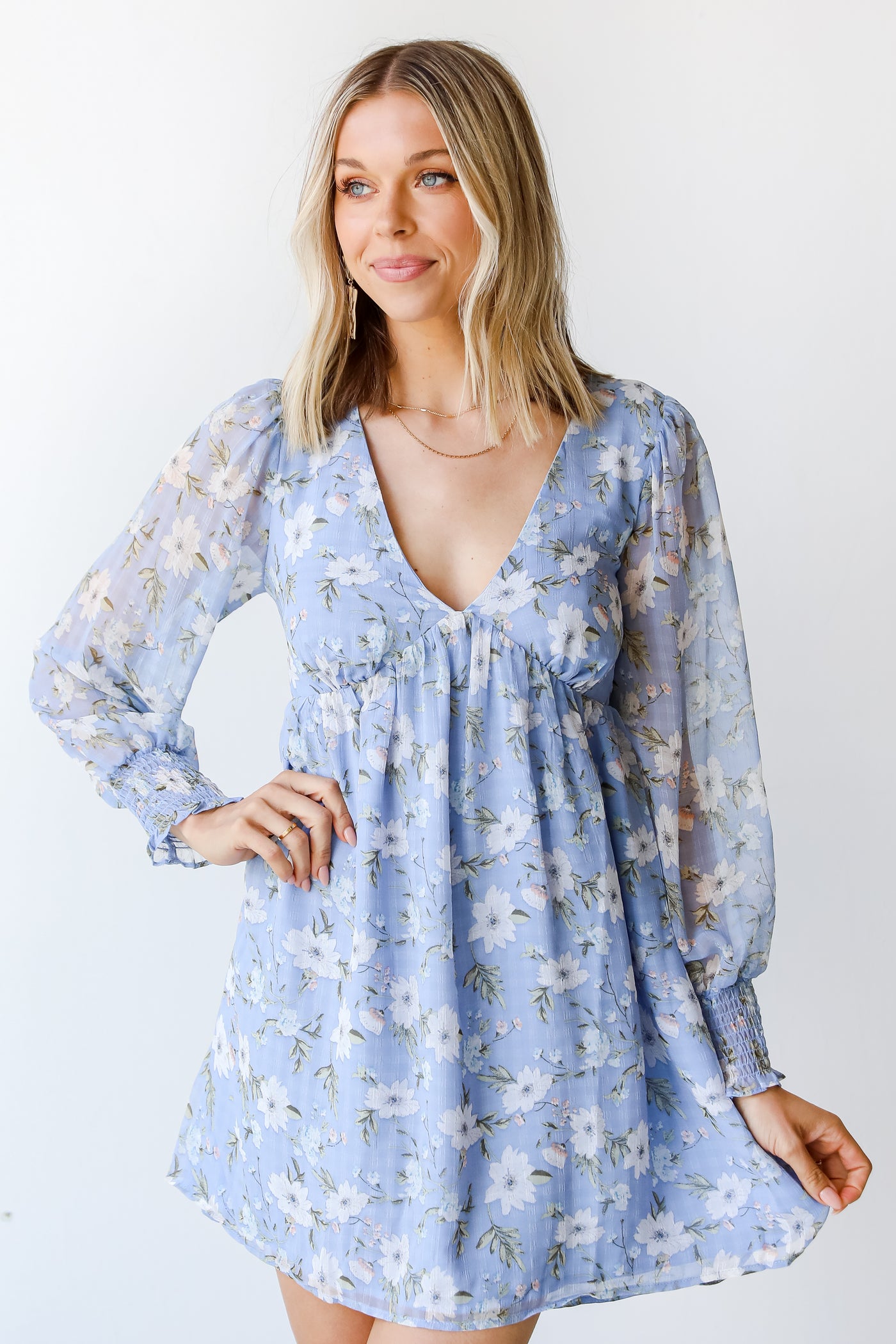 model wearing a blue Floral Mini Dress